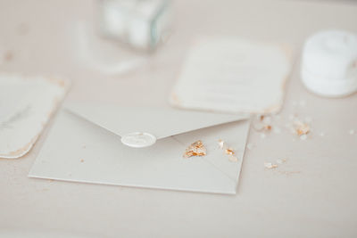 High angle view of paper in plate on table