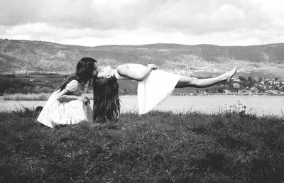 Girl kissing fried by the lake