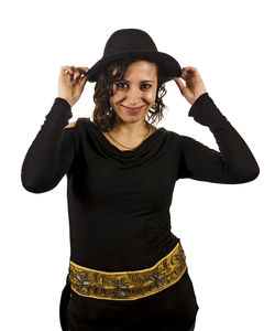 Portrait of young woman standing against white background