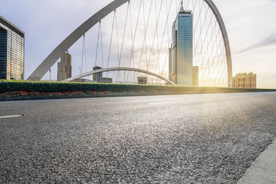 View of modern bridge with buildings in background