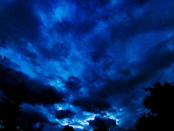 Low angle view of cloudy sky at night