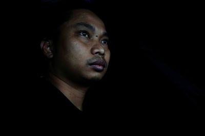 Close-up portrait of a serious young man