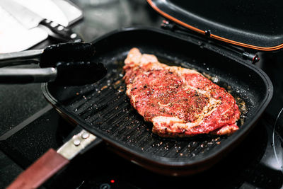 High angle view of meat in cooking pan