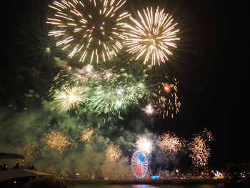 Firework display at night