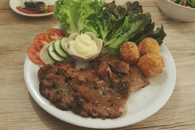 Close-up of food served on table