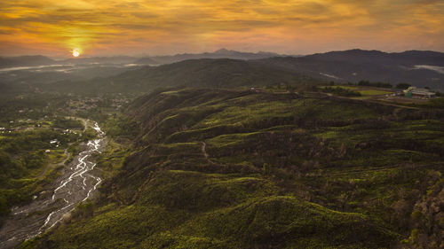 Scenic view of landscape against sky during sunset