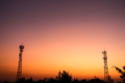 Silhouette of tower against sky during sunset
