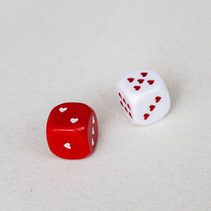 Close-up of red paint over white background