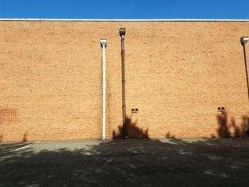 Street by building against sky