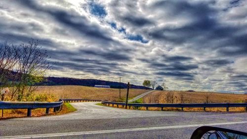 Road against cloudy sky