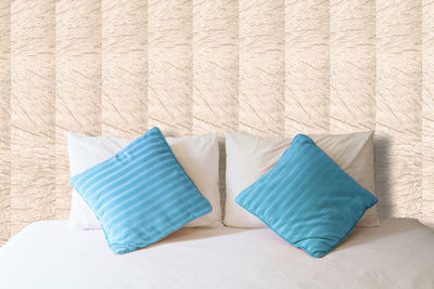 Close-up of pillows on bed at home