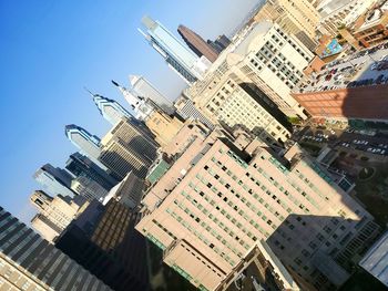 Modern buildings in city against clear sky