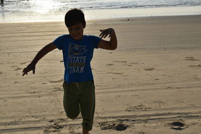 Full length of boy on beach