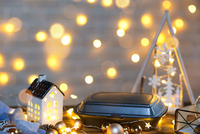 Close-up of illuminated christmas lights on table