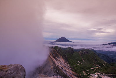 Scenic view of volcanic mountain against sky