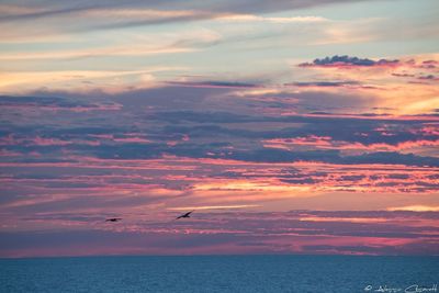 Scenic view of sea against dramatic sky