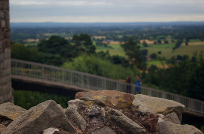 Scenic view of rocks and trees against sky