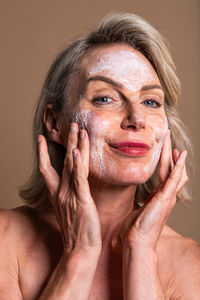 Portrait of young woman with face paint