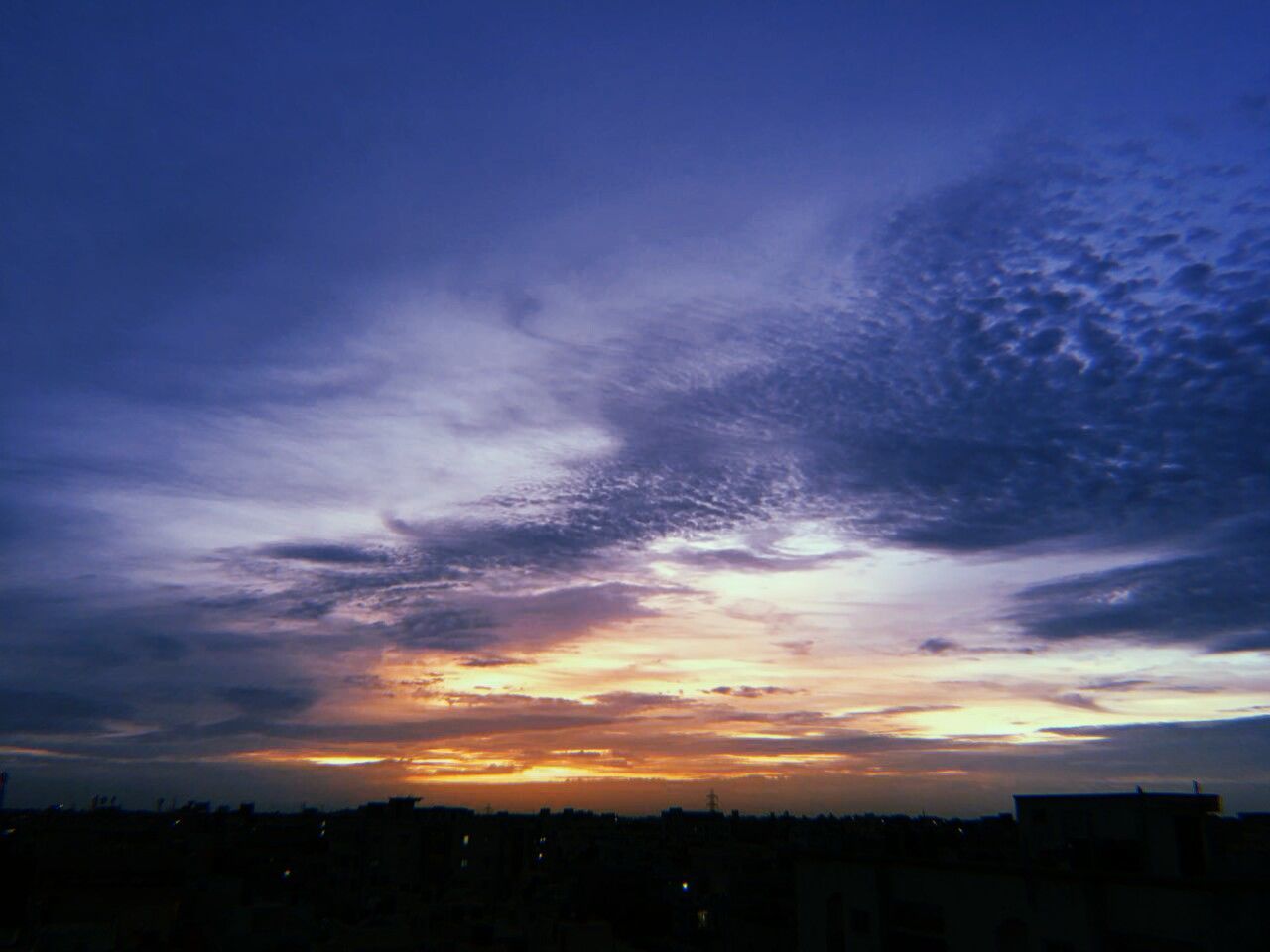 sky, cloud - sky, sunset, architecture, building exterior, built structure, no people, nature, silhouette, building, beauty in nature, city, tranquility, scenics - nature, tranquil scene, orange color, outdoors, urban skyline, residential district, dusk, cityscape, romantic sky