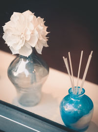 Close-up of flower vase against black background