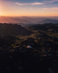 Aerial view of landscape against sky during sunset