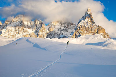 Scenic view of snowcapped mountains against sky