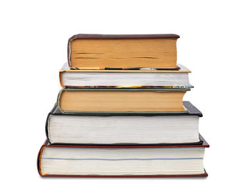 Stack of books against white background