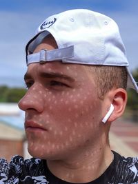 Close-up portrait of young man looking away