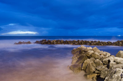 Scenic view of sea against blue sky