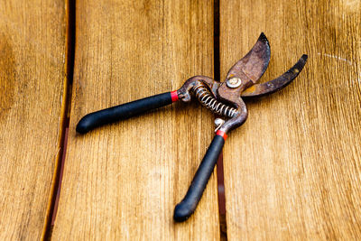 Close-up of chain on wood