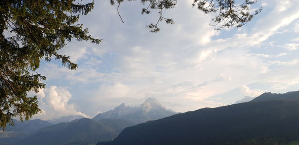 Scenic view of mountains against cloudy sky
