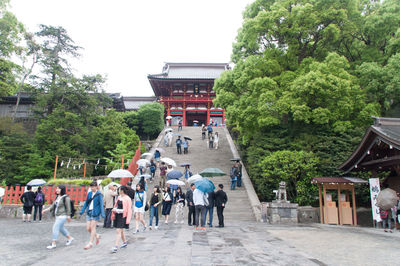 People walking in front of building