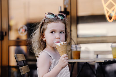 Young woman holding drink