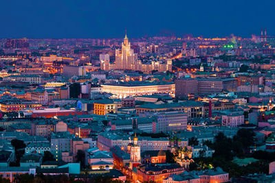 High angle view of illuminated buildings in city