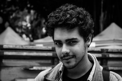 Portrait of smiling young man outdoors