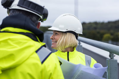 People talking on building site