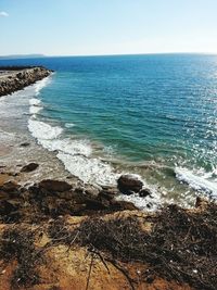 Scenic view of sea against blue sky