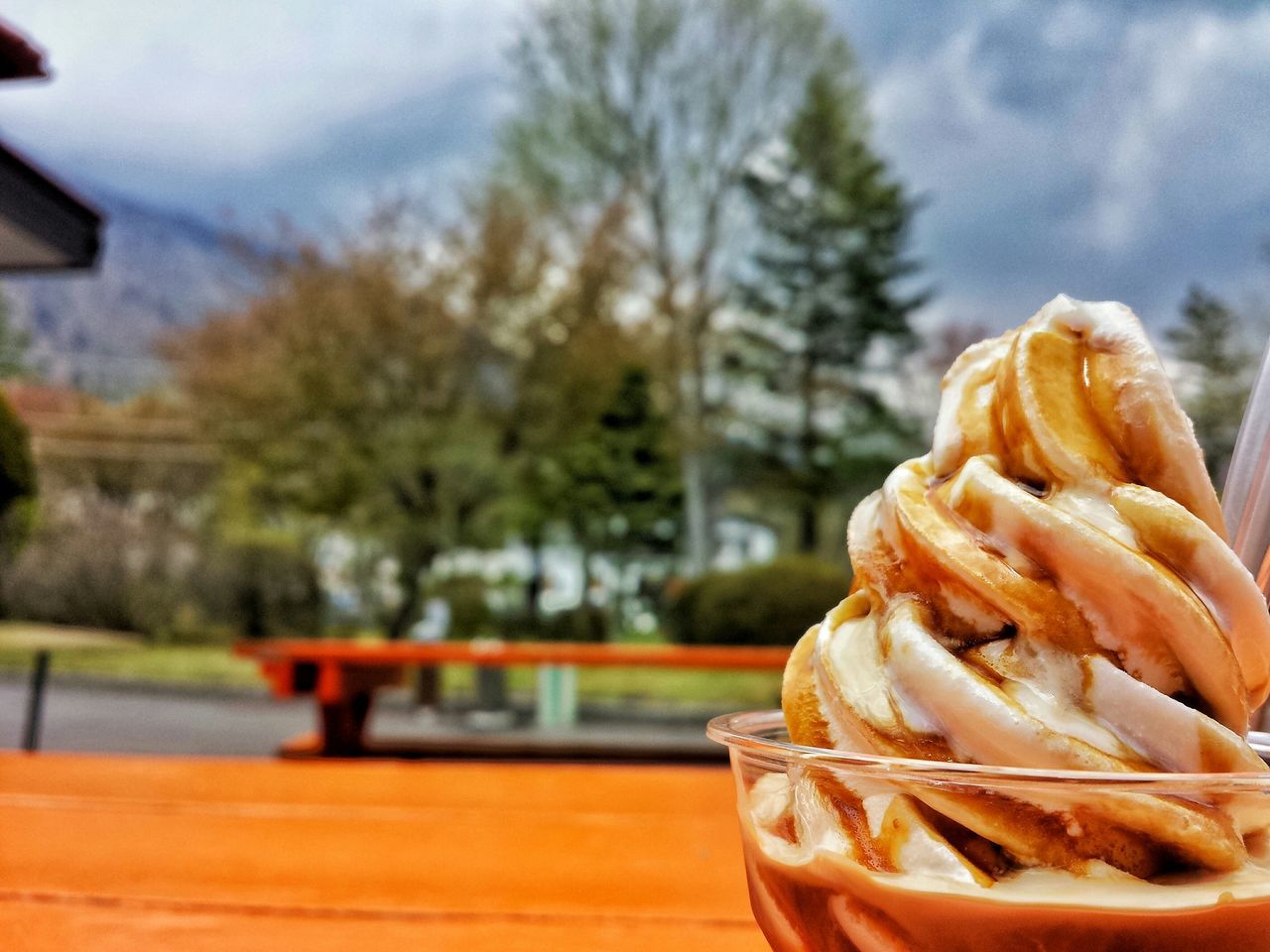 food and drink, focus on foreground, freshness, food, table, close-up, indoors, ready-to-eat, sweet food, selective focus, still life, indulgence, unhealthy eating, incidental people, day, tree, wood - material, glass - material, temptation