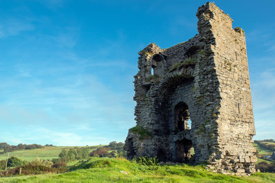 Low angle view of old ruin building against sky