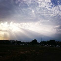 Scenic view of landscape against cloudy sky