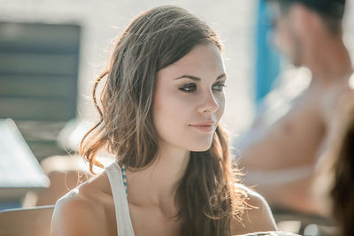 Close-up of beautiful woman looking away