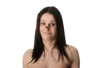 Portrait of smiling young woman against white background