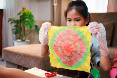 Portrait of smiling woman holding gift