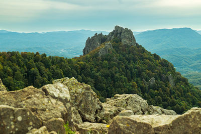 Panoramic view of rocky mountains against sky