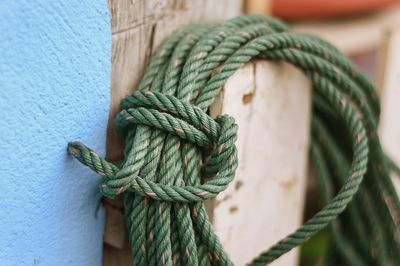 Close-up of rope hanging against wall