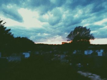 Scenic view of landscape against cloudy sky