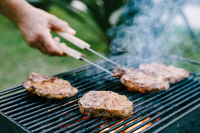 Close-up of meat on barbecue grill