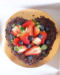 High angle view of strawberries in bowl on table