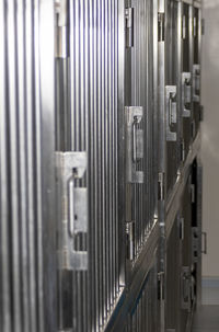 Close-up of metal railing in building