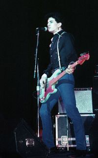 Man playing guitar at music concert